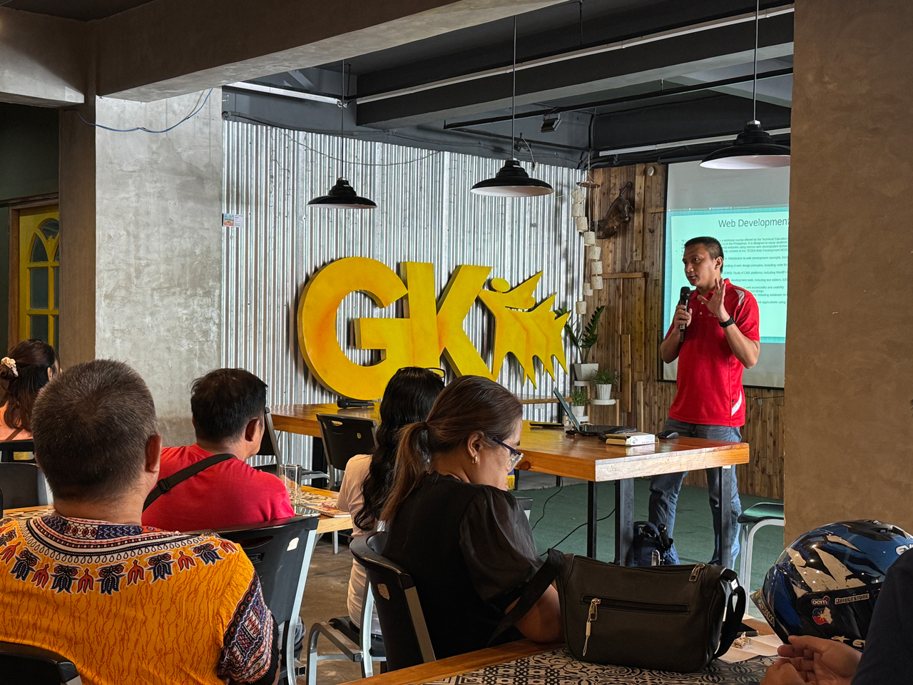 Community livelihood training session by cxperts at Gawad Kalinga, teaching web development skills to empower participants for sustainable employment opportunities