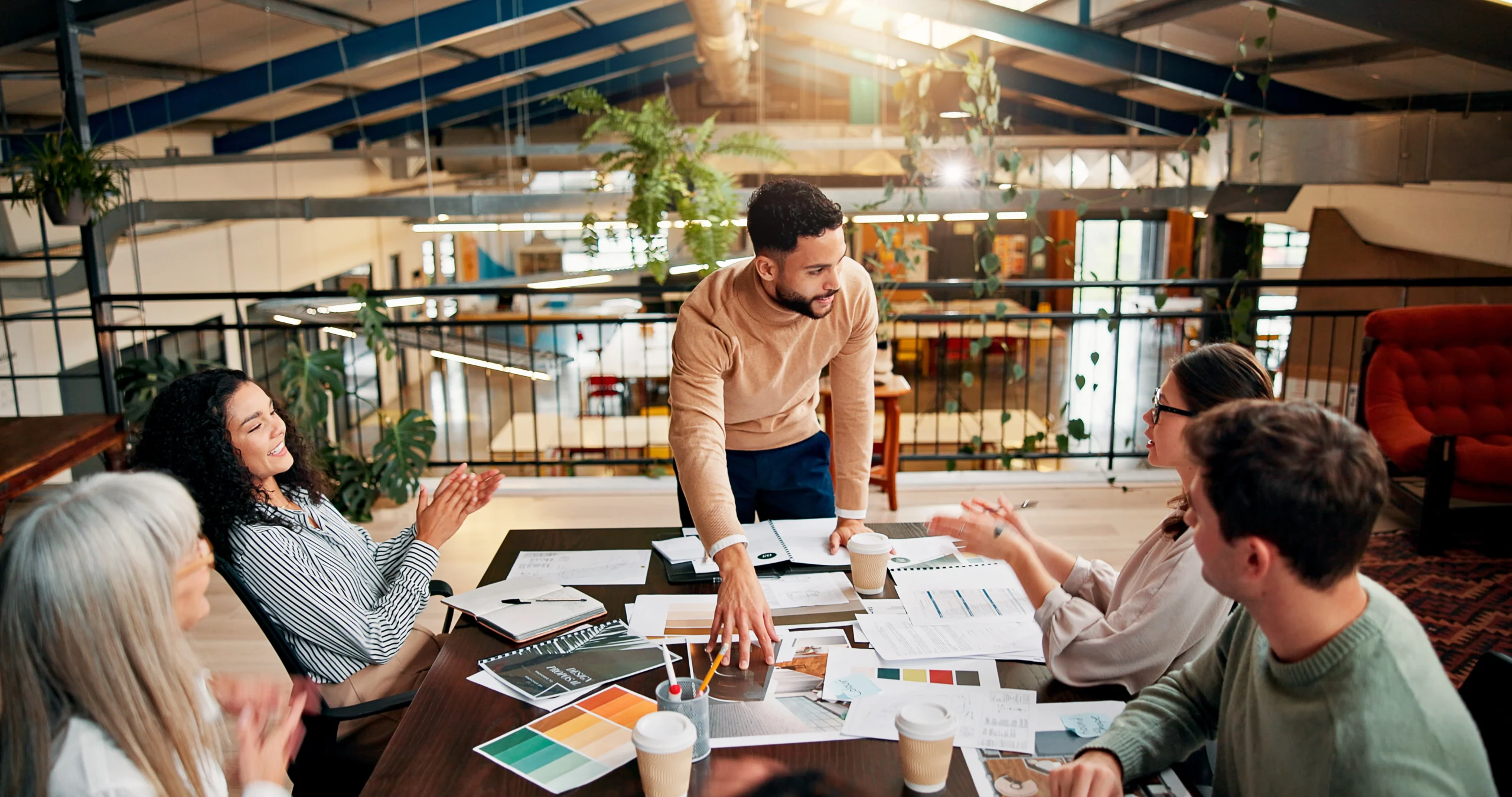 Team collaborating in a modern workspace.