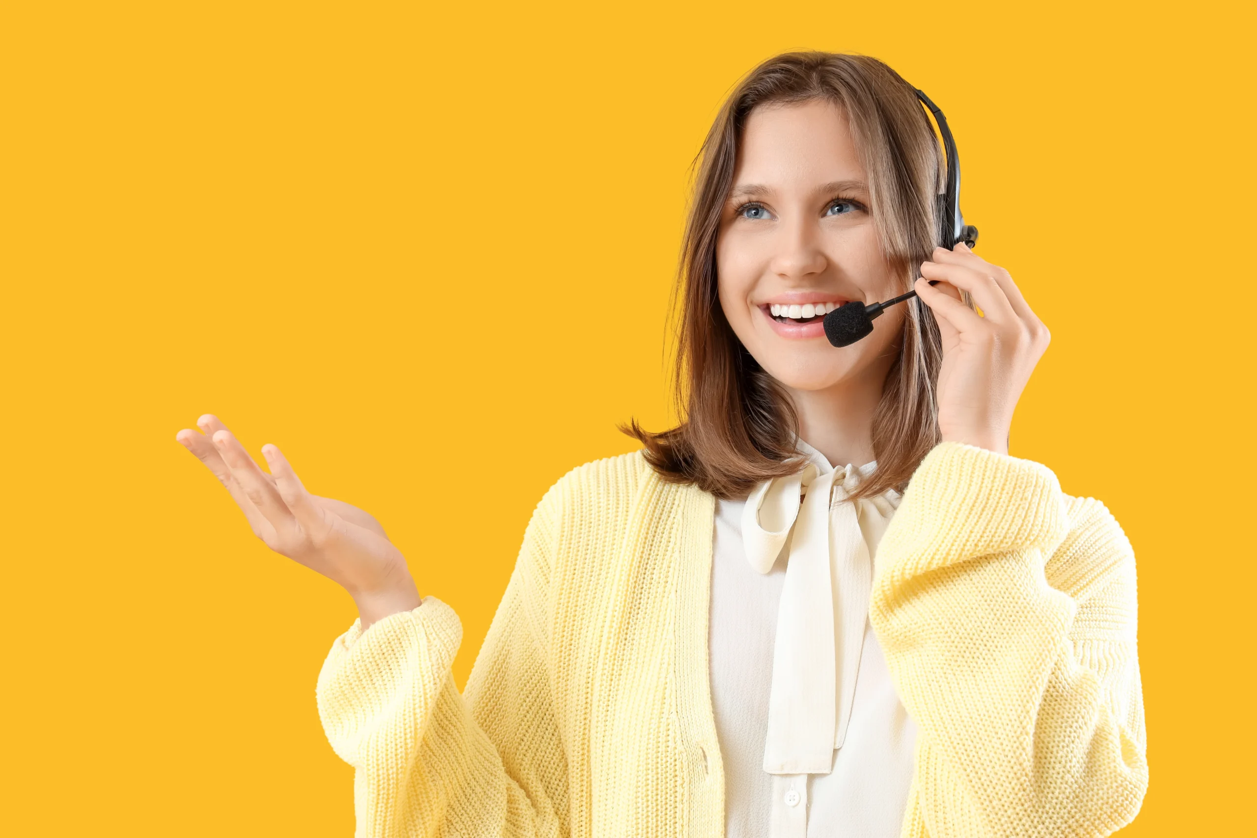 Smiling young woman wearing headset with microphone, customer service and communication concept, call center operator