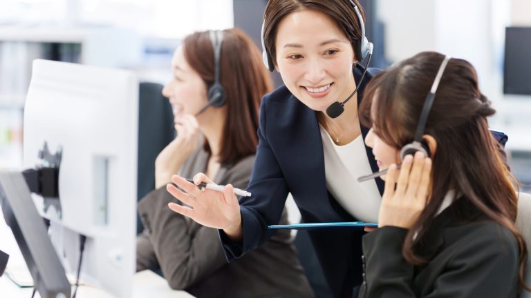 a group of women wearing headsets