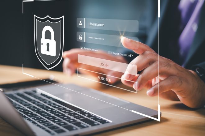 article-239-cxperts-01 Business professional accessing secure login interface on laptop with virtual password protection screen, illustrating cybersecurity, data privacy, and user authentication technology.