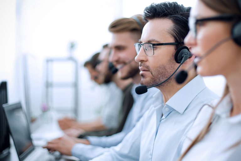 Cxperts Business Process Outsourcing (BPO) professionals working seriously in a modern office environment , collaborating on customer experience solutions