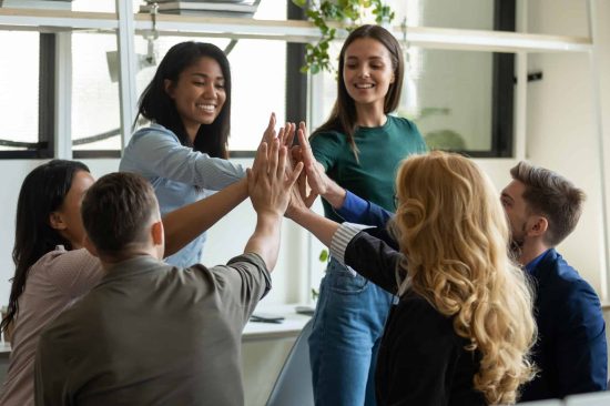 careers-photos-05.jpg group of young people giving high five to one another