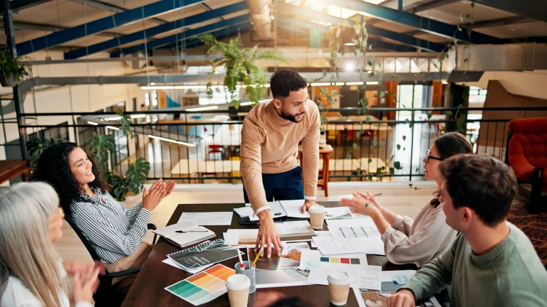 Team collaborating in a modern workspace.