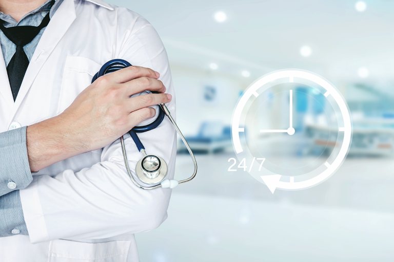 24/7 healthcare support concept with doctor holding stethoscope in hospital setting