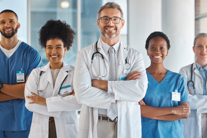 healthcare-02 Diverse team of doctors and nurses smiling in a modern hospital, representing professional healthcare services and patient care